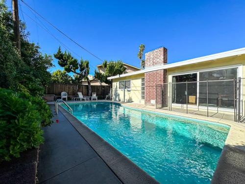a swimming pool in front of a house at 4 BR House With Pool - BB-WW in Los Angeles