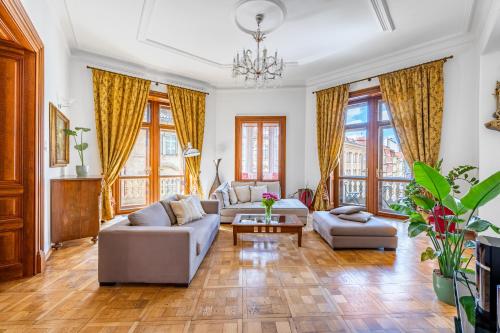 a living room with two couches and a table at Malostranská Residence in Prague