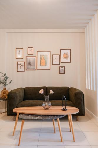 a living room with a couch and a coffee table at Urban Style Suite in Alexandroupoli