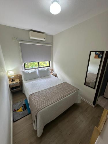 Ένα ή περισσότερα κρεβάτια σε δωμάτιο στο Hotel Mirante