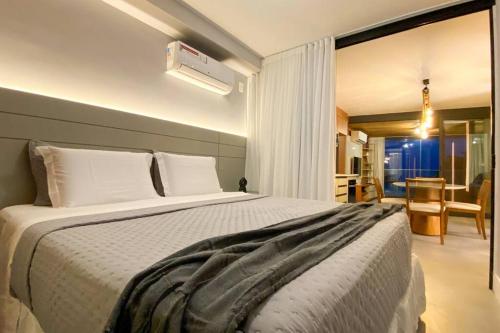 a bedroom with a large bed in a room at Atlântico Collection in Rio de Janeiro
