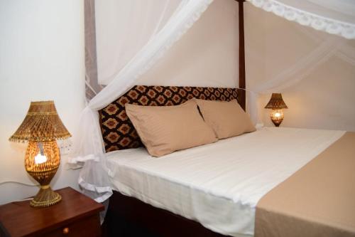 A bed or beds in a room at Susu Villa