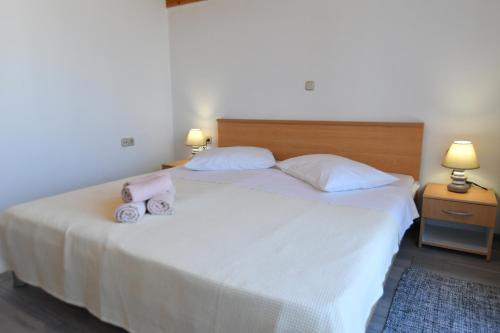 Ένα ή περισσότερα κρεβάτια σε δωμάτιο στο Apartments Perić