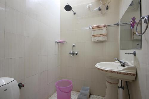 a bathroom with a sink and a toilet at The Villa- a Home away from Home in Ajmer