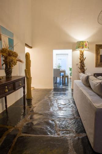 a living room with a couch and a table at Monte da Falagueira by Portus Alacer in Arronches