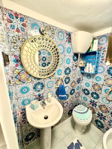a bathroom with a sink and a toilet at Relax House in Bari