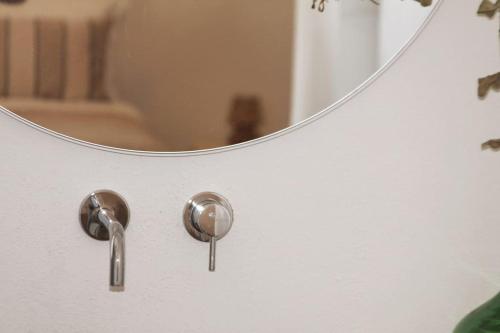 a bathroom with a mirror and a sink at Monte da Falagueira by Portus Alacer in Arronches