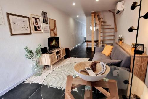 a living room with a glass table and a couch at Casas do Gavião by Portus Alacer in Gavião