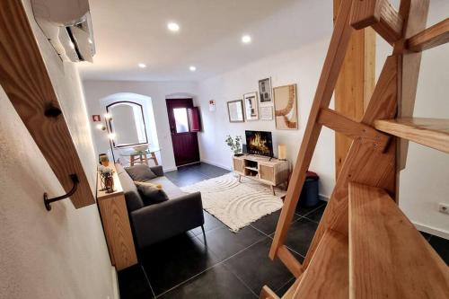 a view of a living room with a stairway at Casas do Gavião by Portus Alacer in Gavião