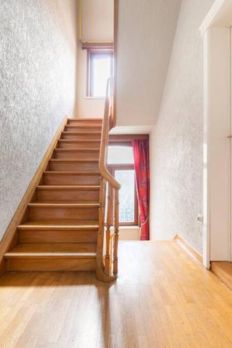 a staircase in a room with a stair case at Suite Stays Bruges in Bruges