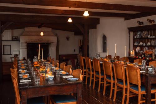 a long dining room with a long table and chairs at Rosehill House in Dungannon