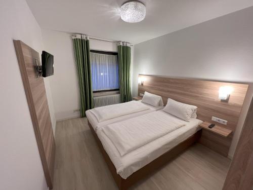 Katil atau katil-katil dalam bilik di Aparthotel Deutschmeister