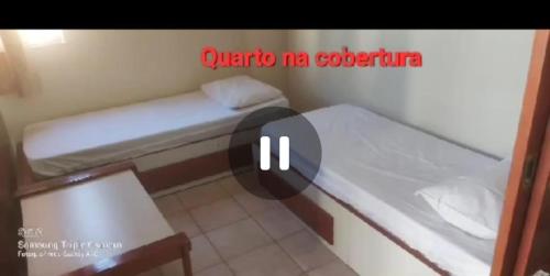 a picture of a small room with a bed at Cobertura Parque das Aguas in Caldas Novas