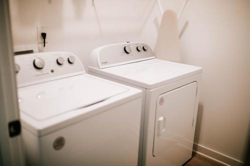 two white appliances sitting next to each other in a kitchen at Artists Retreat - Dt Athens, Uga, Classic Center in Athens