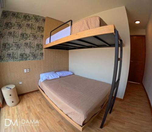 a bedroom with two bunk beds in a room at Casa Dama in Cieneguilla