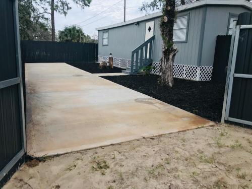a concrete driveway in front of a house at 10515 Houston Avenue in Hudson