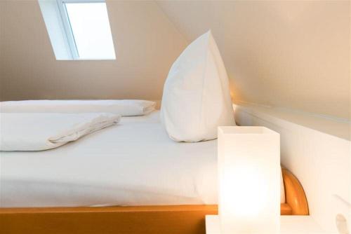 Ένα ή περισσότερα κρεβάτια σε δωμάτιο στο Haus-Fili