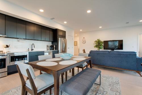 a kitchen and living room with a table and chairs at River View, Central, Elevator, Private Parking in Nashville