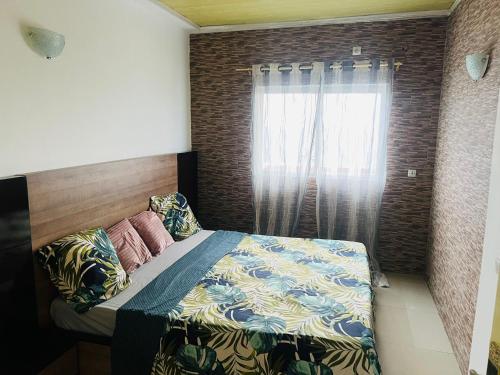Un pat sau paturi într-o cameră la Cocooning vue sur mer
