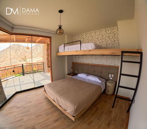 a bedroom with two bunk beds and a balcony at Dama Suites & Spa in Cieneguilla