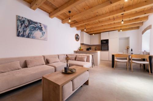a living room with a couch and a table at Hidden House Porta in Krk