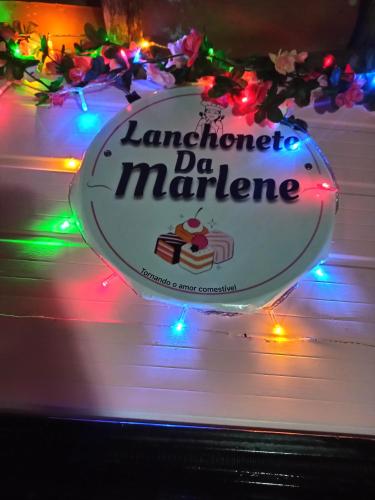 a sign that reads lantoretto de mariere with lights at Casa da Marlene in Guaramiranga