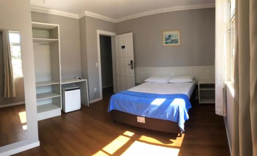 Ένα ή περισσότερα κρεβάτια σε δωμάτιο στο Monte Líbano II