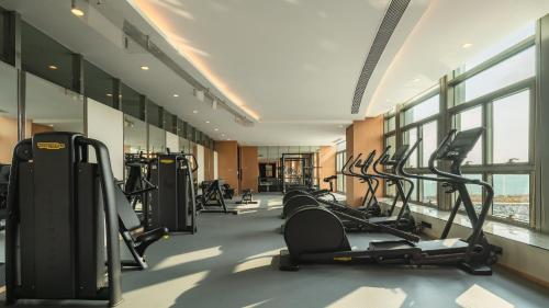 a gym with treadmills and elliptical machines at InterContinental Suzhou Hotel by IHG in Suzhou