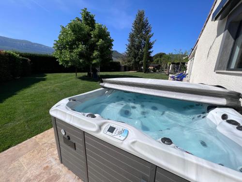 a hot tub in the backyard of a house at VILLA SAINTE BAUME Piscine Jacuzzi tout confort in Nans-les-Pins
