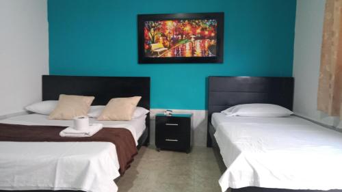 Postel nebo postele na pokoji v ubytování HOTEL LUZ MERY