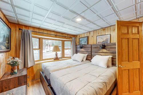 a bedroom with a large bed in a house at Hermit Lake Retreat in Sanbornton