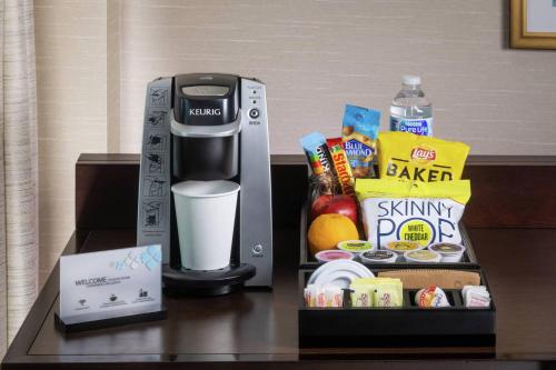 a coffee maker sitting on top of a table at Hilton Garden Inn Detroit Troy in Troy