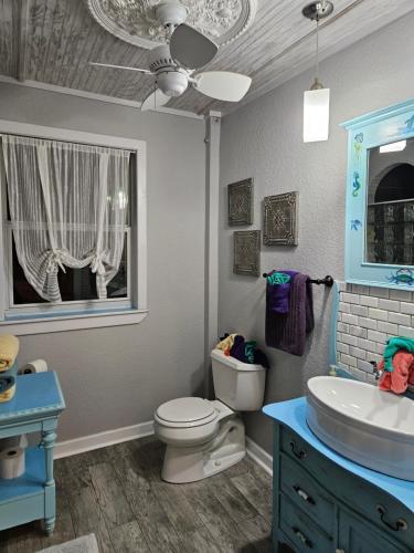 a bathroom with a toilet and a sink at The Beach House at Si Como No Inn in Flagler Beach