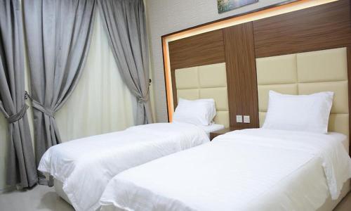 Ένα ή περισσότερα κρεβάτια σε δωμάτιο στο تراس للأجنحة الفندقية