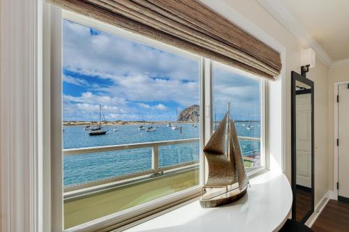 a window with a view of the water and boats at Estero Inn in Morro Bay