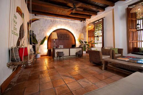 a large living room with a table and chairs at Hotel Bantu by Faranda Boutique, a member of Radisson Individuals in Cartagena de Indias