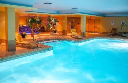 a large swimming pool in a hotel room at Radisson Hotel Red Deer in Red Deer