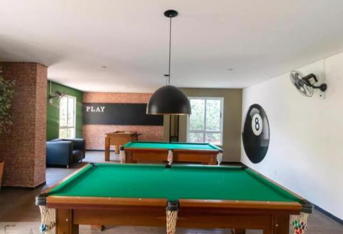 a billiard room with a pool table in it at Quarto e Sala Feminio de Luxo com Lazer Para Duas Hóspedes Próximo ao Parque Taquaral in Campinas