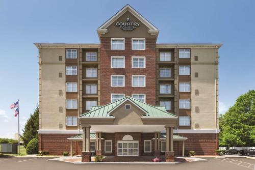 eine Darstellung eines Hotelgebäudes in der Unterkunft Country Inn & Suites by Radisson, Conyers, GA in Conyers