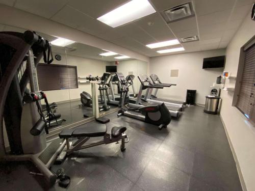 a gym with several tread machines in a room at Country Inn & Suites by Radisson, Athens, GA in Athens