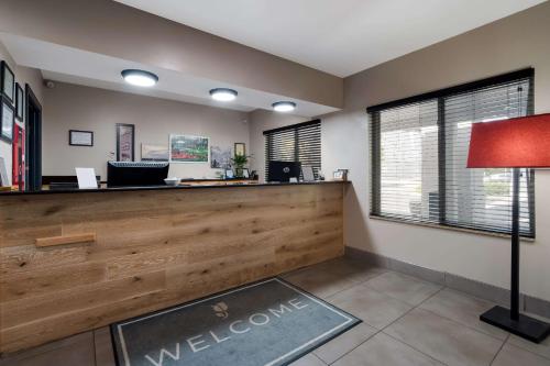 a waiting room with a welcome sign on the counter at Country Inn & Suites by Radisson, Augusta at I-20, GA in Augusta