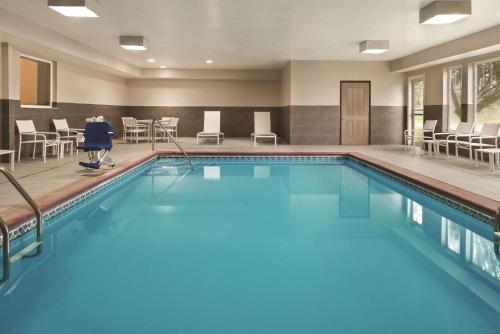 a pool with blue water in a hotel room at Country Inn & Suites by Radisson, Indianapolis South, IN in Indianapolis