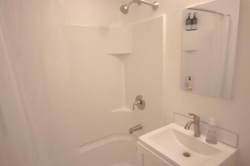 a white bathroom with a sink and a shower at Ocean Way One Bedroom in Los Angeles
