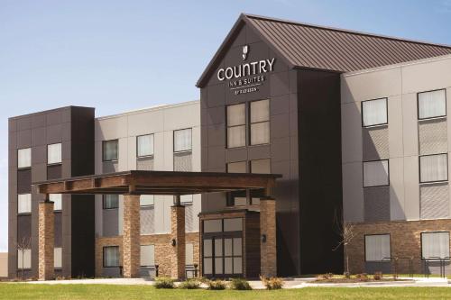 a rendering of the front of a building at Country Inn & Suites by Radisson, Lawrence, KS in Lawrence