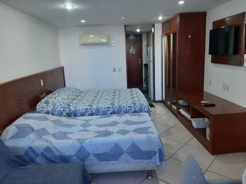 Кровать или кровати в номере Flat no Sol Vitória Marina 2