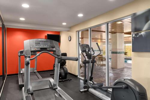 a fitness room with a gym with tread machines at Country Inn & Suites by Radisson, Rochester South, MN in Rochester