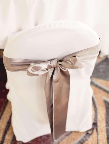 a white stool with a bow on top of it at Radisson Hotel Corning in Corning