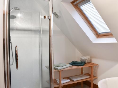 a bathroom with a shower and a sink at Sycamore Cottage - Uk45923 in Ballater