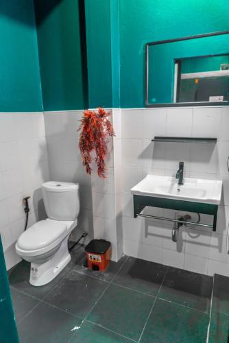 a bathroom with a toilet and a sink at Scubadoo house and Diving in Ko Tao