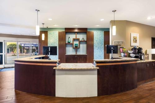 a lobby of a hotel with a coffee bar at Country Inn & Suites by Radisson, Virginia Beach Oceanfront , VA in Virginia Beach